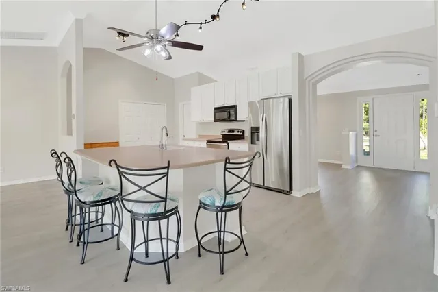 a dining room with furniture and wooden floor
