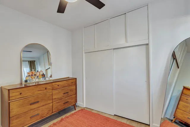 a view of backyard with wooden fence