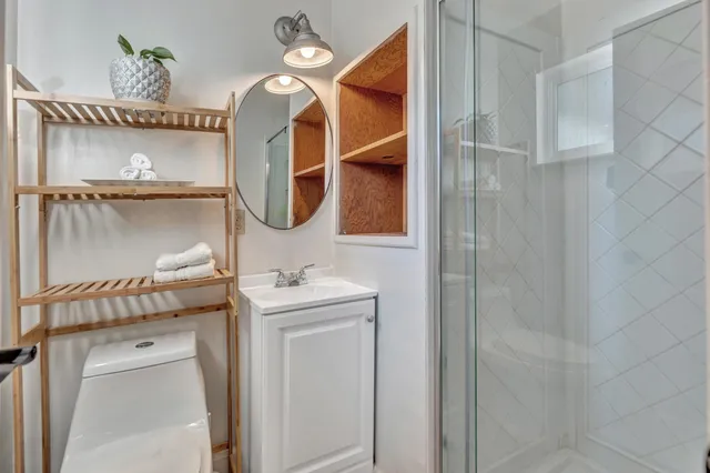 a view of a workspace with furniture and wooden floor