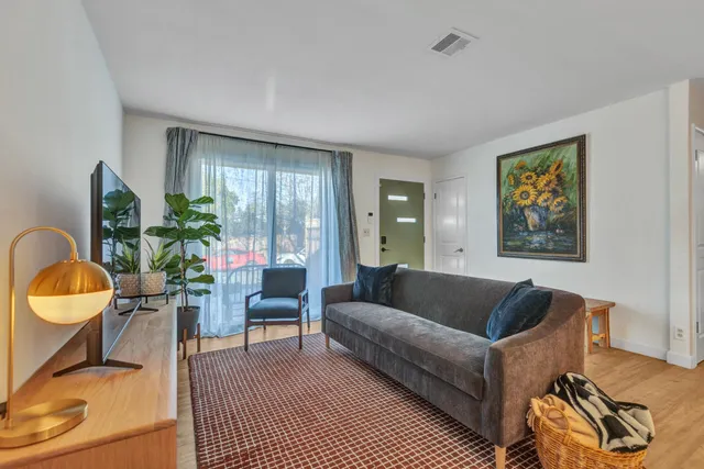 a bedroom with bed and a window