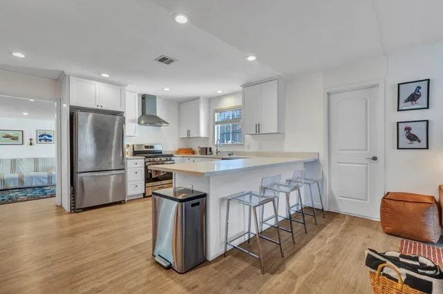 a bathroom with a toilet a sink and a mirror