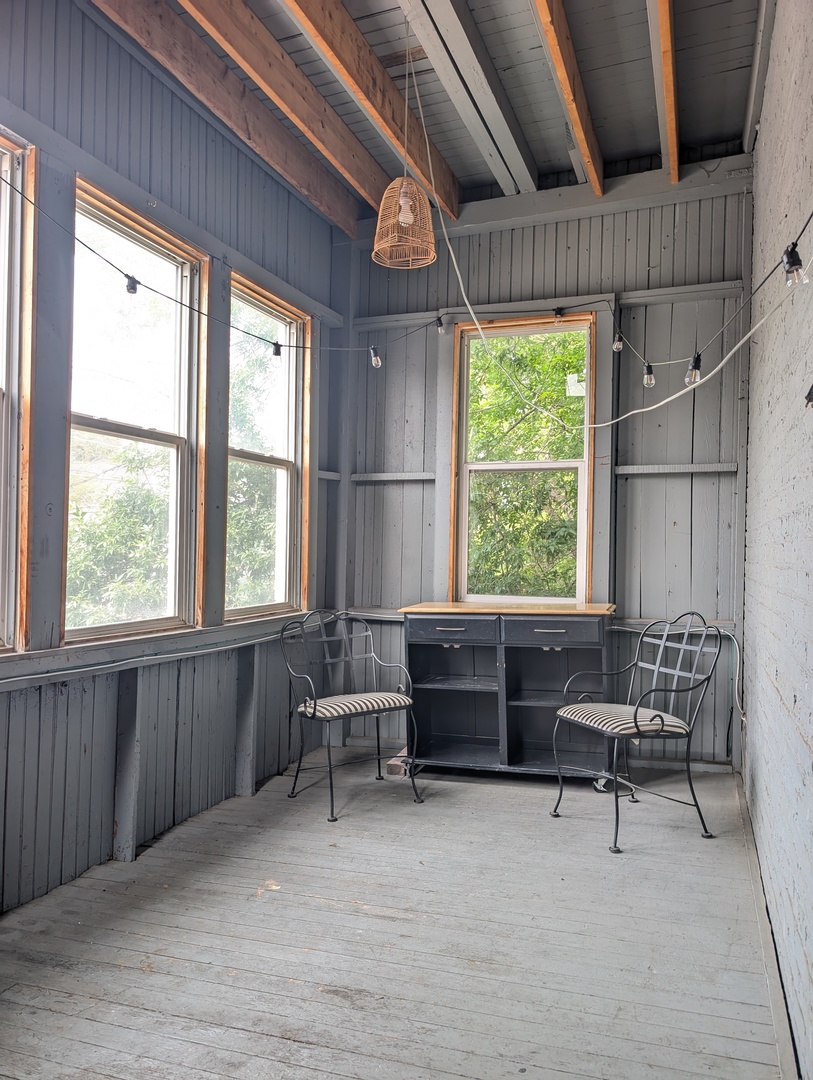 2611 West George Street, Unit 2R Chicago, IL 60618 - Photo 11 of 14 a living room with furniture and a large window
