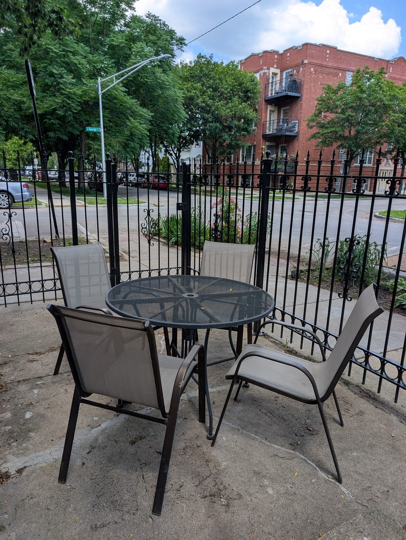 2611 West George Street, Unit 2R Chicago, IL 60618 - Photo 12 of 14 a view of a chairs and table in the back yard