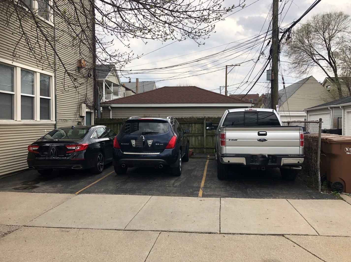 2611 West George Street, Unit 2R Chicago, IL 60618 - Photo 13 of 14 a view of cars parked in front of a house