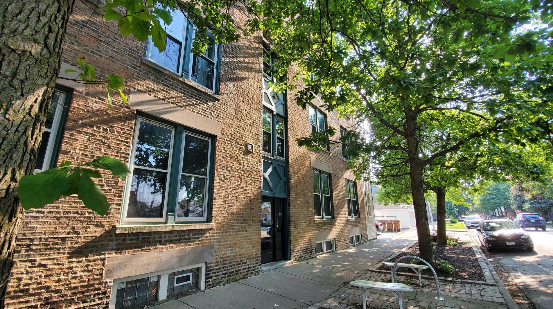 2611 West George Street, Unit 2R Chicago, IL 60618 - Photo 2 of 14 a view of a brick house with many windows