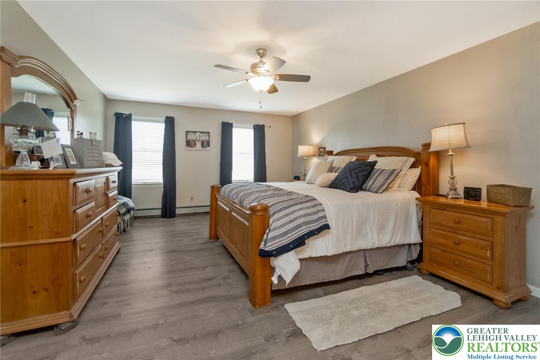 9461 Red Road Kempton, PA 19529 - Photo 24 of 55 Peaceful master bedroom with multiple windows for abundant light.