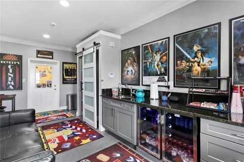 a living room with furniture fireplace and a large window
