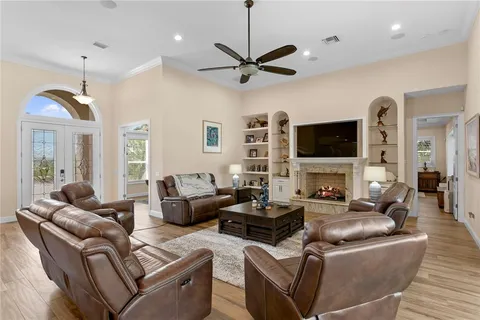 a bathroom with a granite countertop double vanity sink and a mirror
