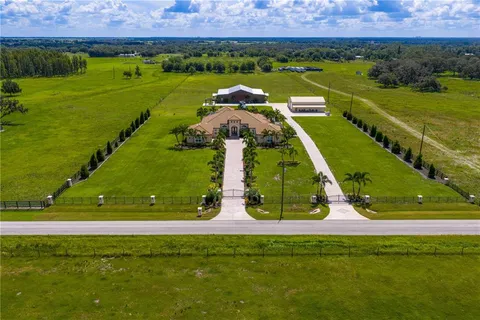 a patio with a table and chairs