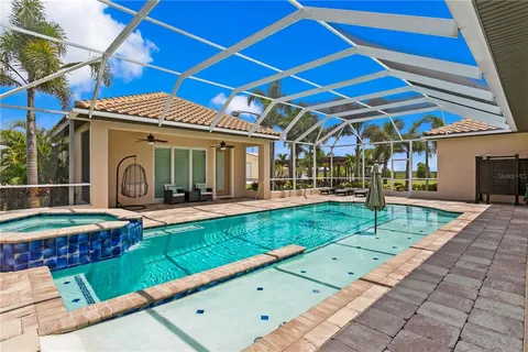 a living room with furniture a view of bedroom and a couch