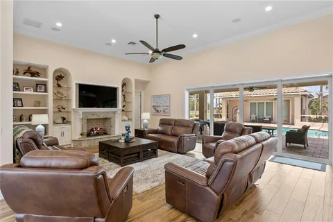 a view of a house with a yard balcony and swimming pool