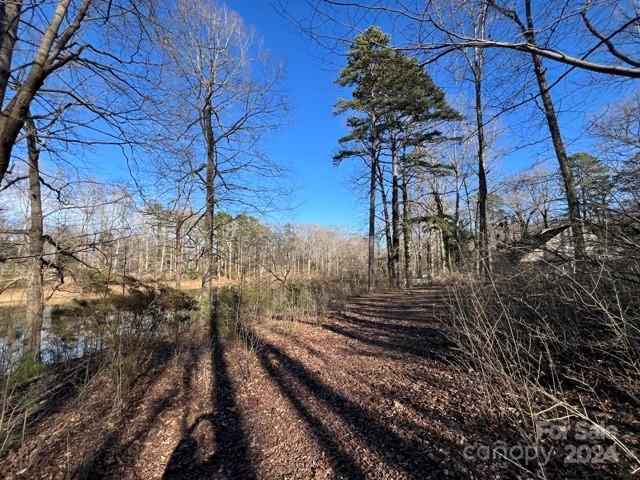 7100 Ridge Lane Road Charlotte, NC 28262 - Photo 9 of 11 a view of a yard with wooden fence
