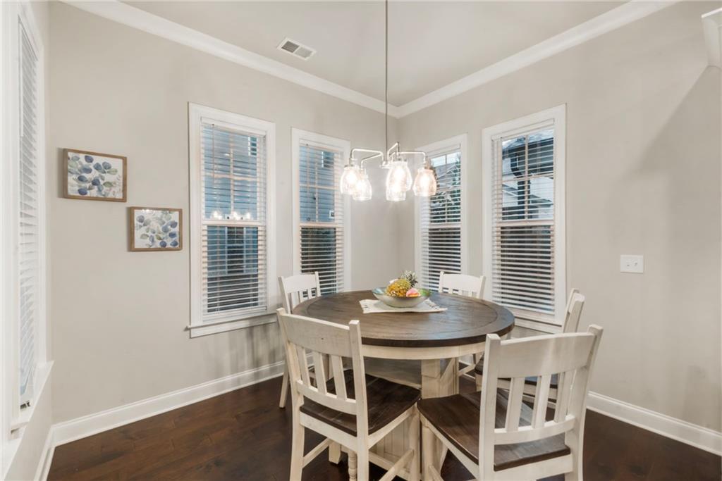 313 Senna Street Marietta, GA 30064 - Photo 15 of 43 a view of a dining room with furniture windows and wooden floor