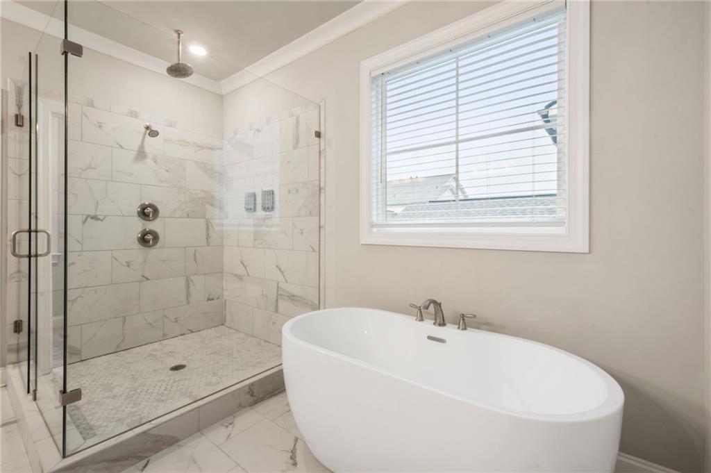 313 Senna Street Marietta, GA 30064 - Photo 31 of 43 a white bath tub sitting next to a shower