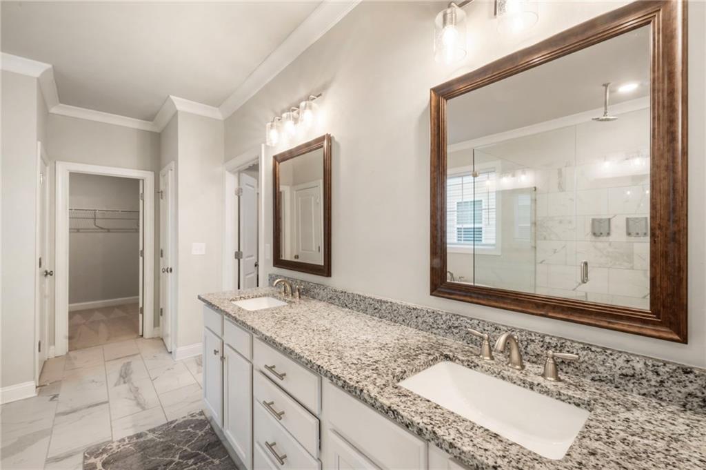 313 Senna Street Marietta, GA 30064 - Photo 32 of 43 a bathroom with a granite countertop sink and a mirror