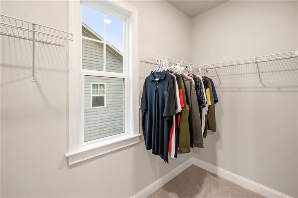 313 Senna Street Marietta, GA 30064 - Photo 34 of 43 a view of walk in closet with clothes