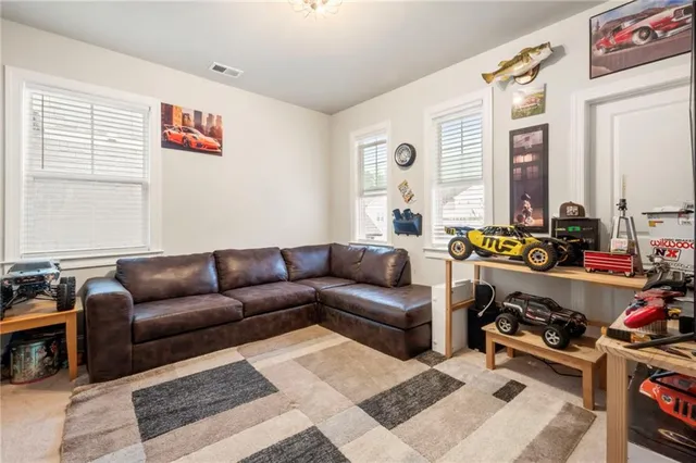 a bathroom with a granite countertop sink a mirror and a bathtub