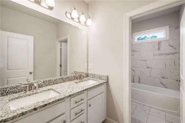 a bathroom with a toilet and bathtub