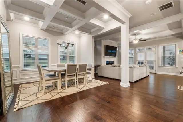 a dining room with furniture and window