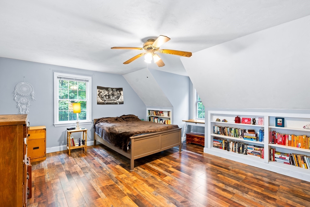 28 Birch Drive Petersham, MA 01366 - Photo 16 of 42 a living room with furniture and a book shelf