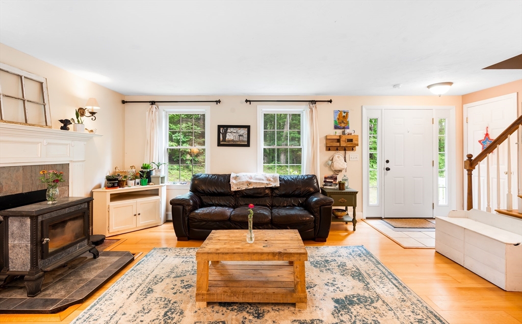 28 Birch Drive Petersham, MA 01366 - Photo 3 of 42 a living room with furniture and a fireplace