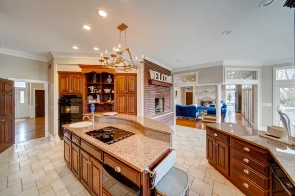 a kitchen with stainless steel appliances granite countertop a stove and a sink