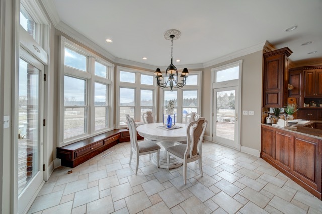 3870 North 3000 W Road Bourbonnais, IL 60914 - Photo 14 of 47 a dining room with furniture a chandelier and fireplace