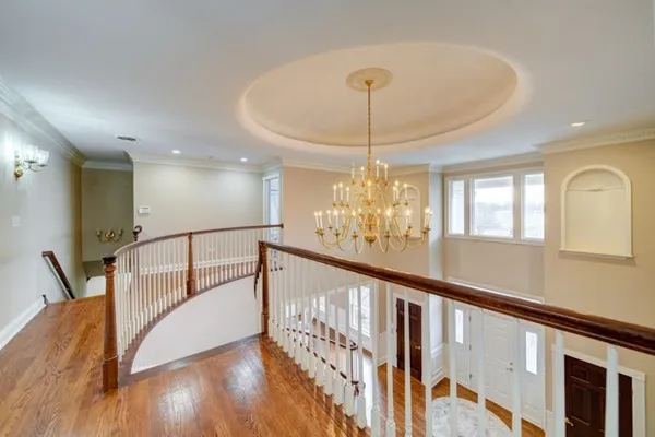 a view of a livingroom with furniture a dinning room and stairs