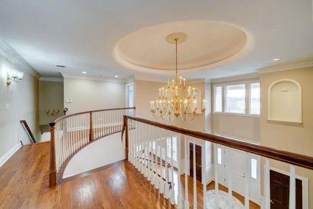 a view of a livingroom with furniture a dinning room and stairs