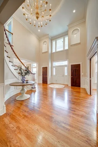 a view of an entryway with wooden floor