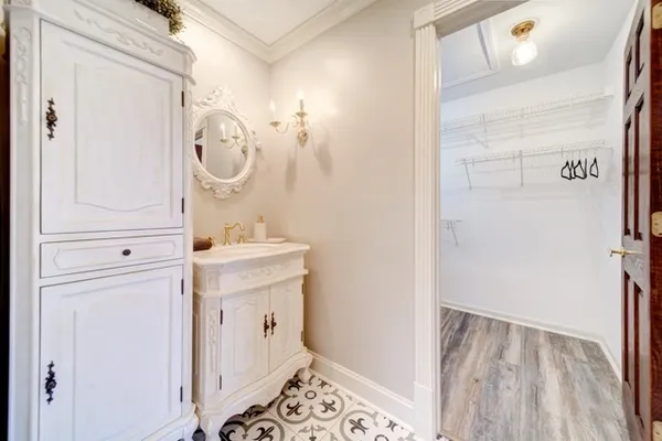 a bathroom with a sink a mirror and a toilet