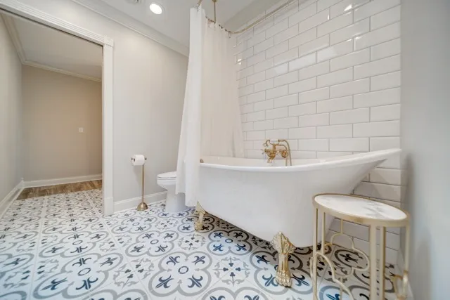 a bathroom with a sink toilet and a mirror