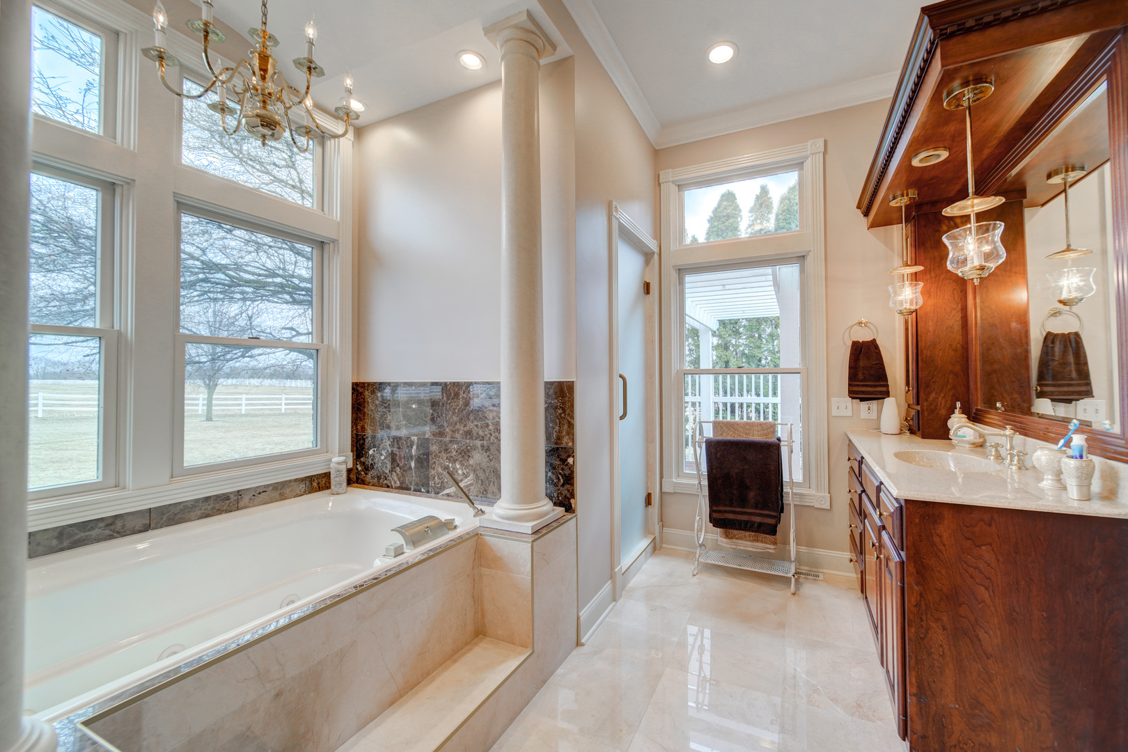 3870 North 3000 W Road Bourbonnais, IL 60914 - Photo 30 of 47 a spacious bathroom with a granite countertop tub sink and mirror