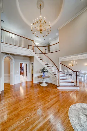 a view of entryway and hall with wooden floor