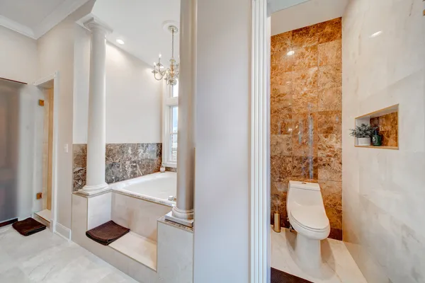 a bathroom with a toilet sink and shower