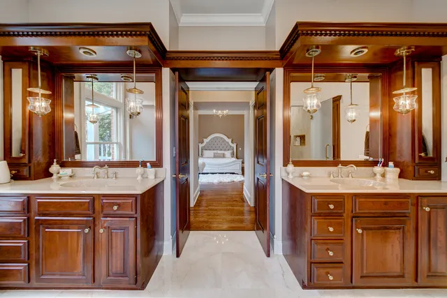 a bathroom with a sink a large mirror and a shower