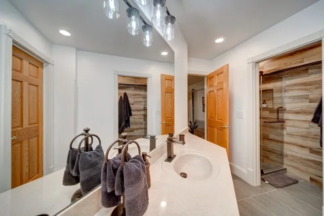 a bathroom with a sink and a mirror