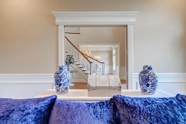 a living room with a couch and potted plant