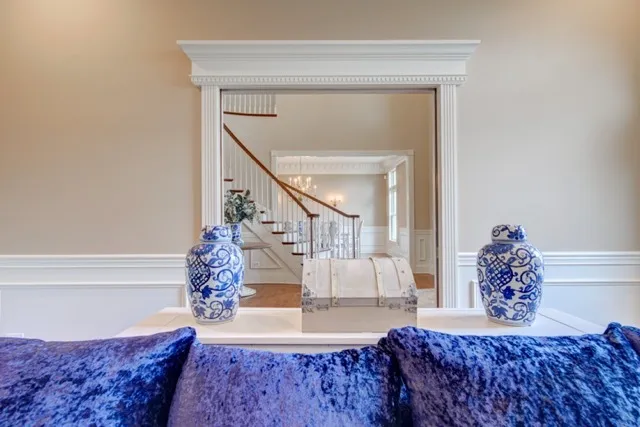 a living room with a couch and potted plant