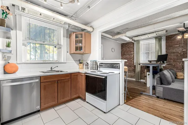 a refrigerator freezer sitting inside of a kitchen