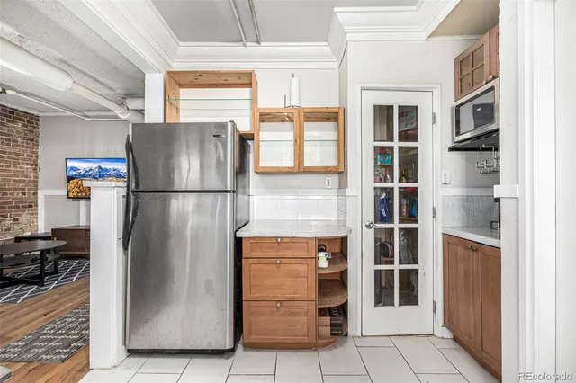 a white kitchen with a stove and a sink