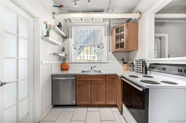 a kitchen with cabinets and outdoor view