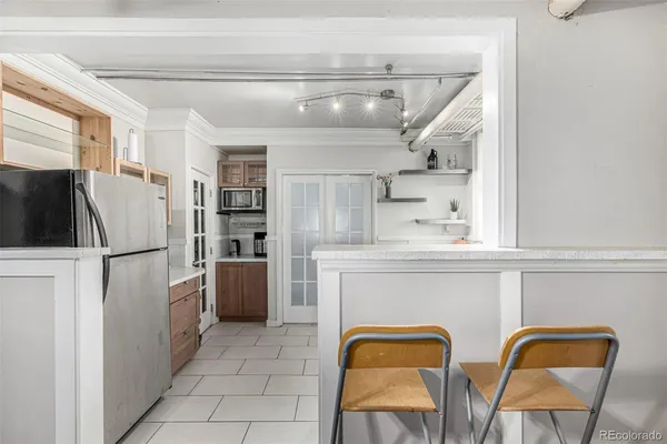 a large bed sitting in a bedroom and a flat tv screen