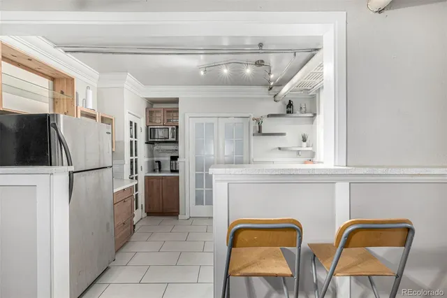 a large bed sitting in a bedroom and a flat tv screen