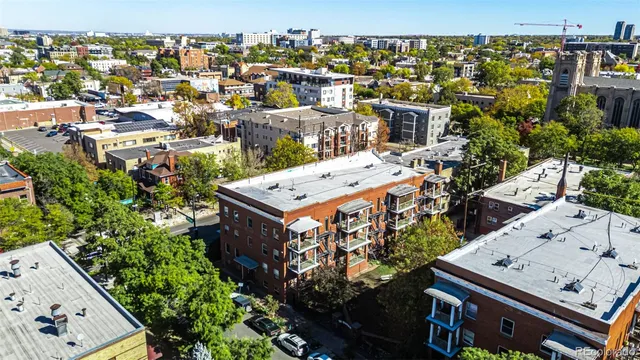 an aerial view of a city with lots of residential buildings