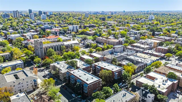 an aerial view of a city and lake view