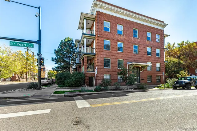 a view of a building with a street