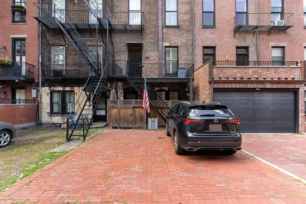 a car parked in front of a building