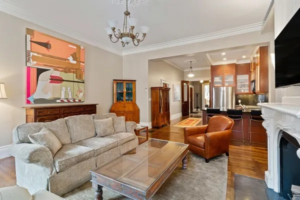 a living room with furniture fireplace and a flat screen tv