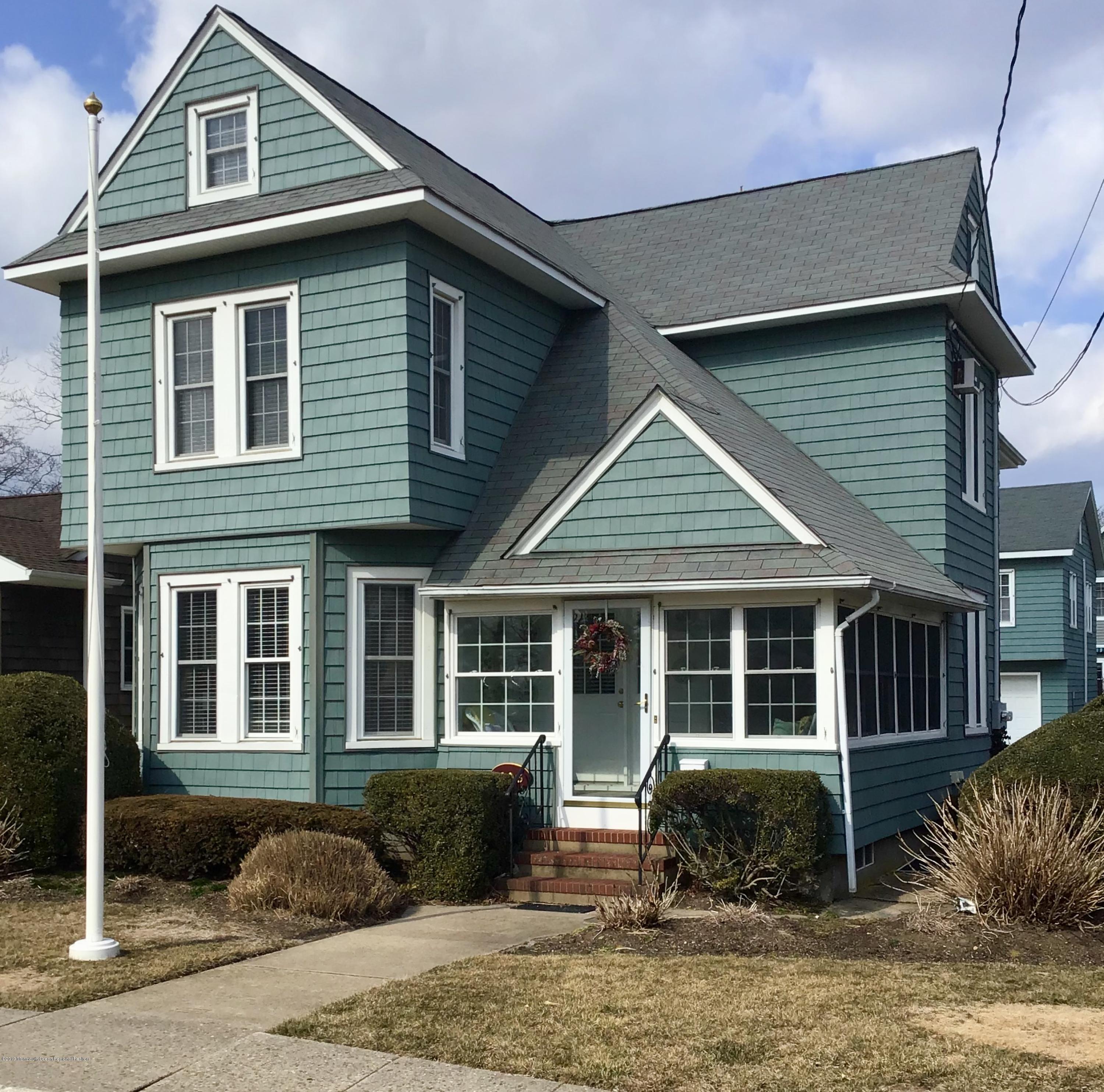 606 Ocean Road Spring Lake Heights, NJ 07762 - Photo 1 of 42 a front view of a house with a yard